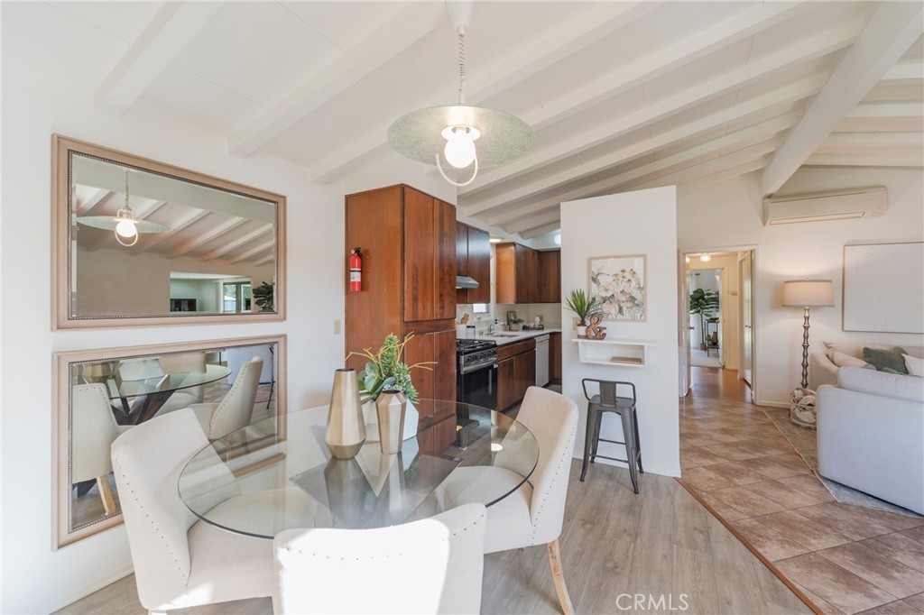 934 North Maple Street Anaheim, CA 92801 - Photo 14 of 47 a view of a dining room with furniture a kitchen and chandelier