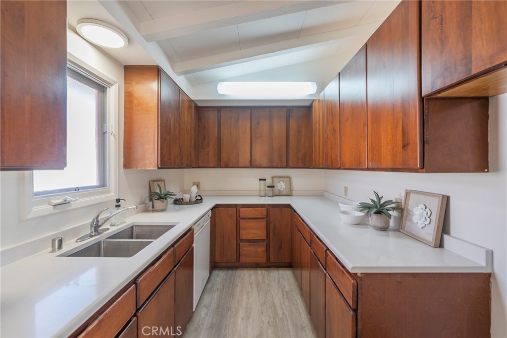 934 North Maple Street Anaheim, CA 92801 - Photo 15 of 47 a kitchen with a sink stove and cabinets