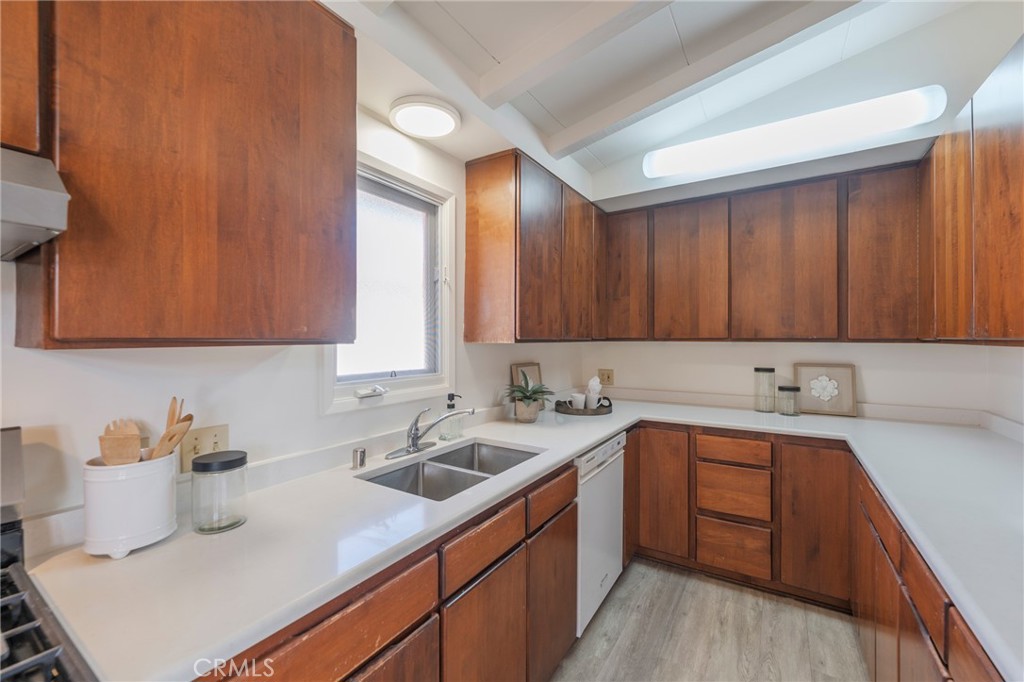934 North Maple Street Anaheim, CA 92801 - Photo 16 of 47 a kitchen with a sink cabinets and stainless steel appliances
