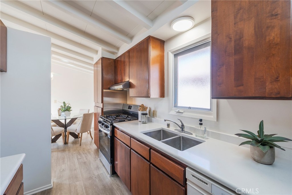 934 North Maple Street Anaheim, CA 92801 - Photo 20 of 47 a kitchen with a sink cabinets and wooden floor
