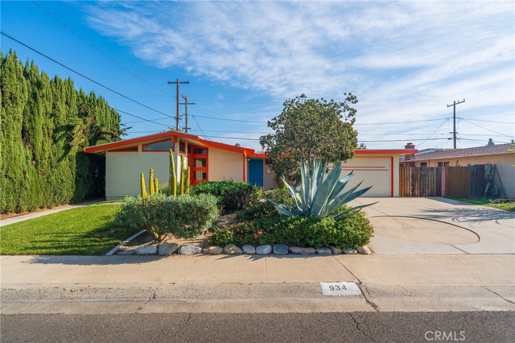 934 North Maple Street Anaheim, CA 92801 - Photo 2 of 47 a front view of a house with a garden and plants
