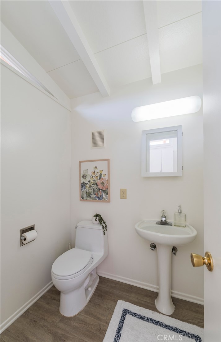 934 North Maple Street Anaheim, CA 92801 - Photo 22 of 47 a bathroom with a toilet sink and mirror