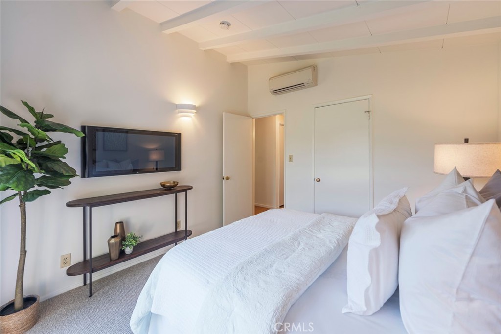 934 North Maple Street Anaheim, CA 92801 - Photo 25 of 47 a bedroom with a bed and a flat screen tv