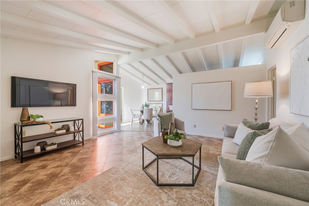 934 North Maple Street Anaheim, CA 92801 - Photo 9 of 47 a living room with furniture and a flat screen tv