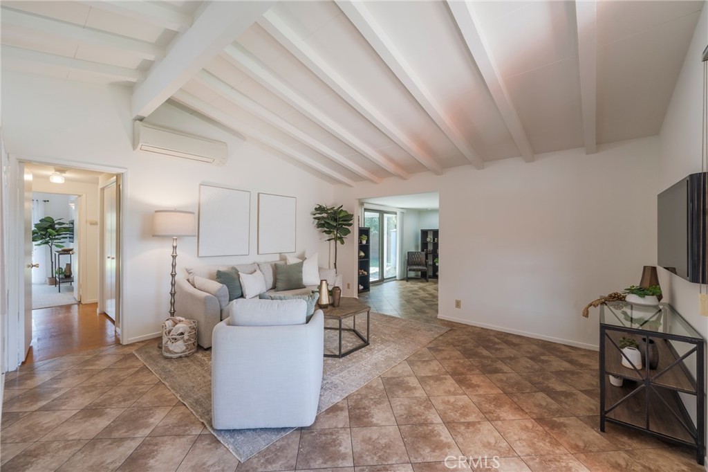 934 North Maple Street Anaheim, CA 92801 - Photo 10 of 47 a living room with furniture and a flat screen tv