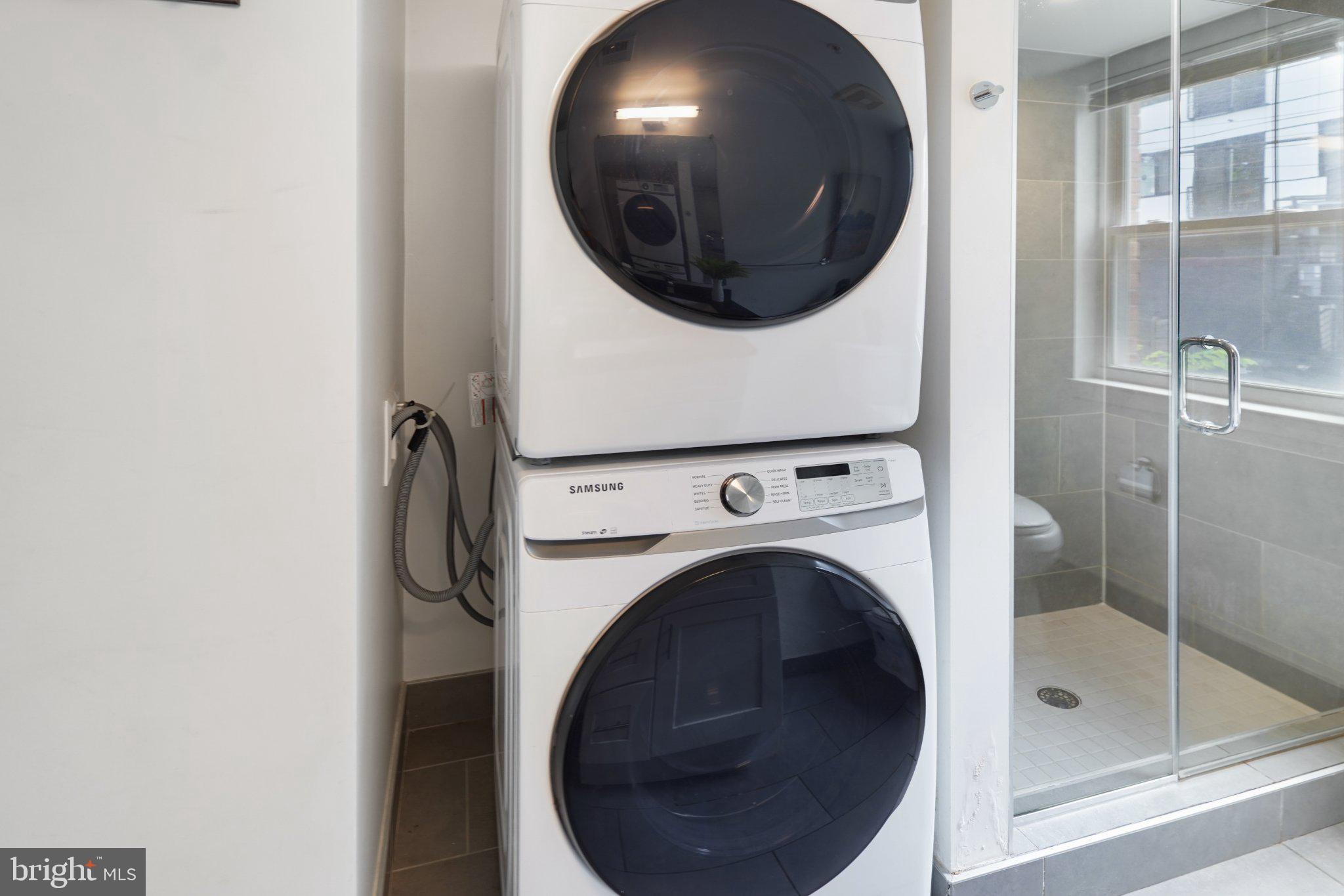 7723 Alaska Avenue Northwest, Unit 103 Washington, DC 20012 - Photo 8 of 12 Modern laundry setup with sleek design.