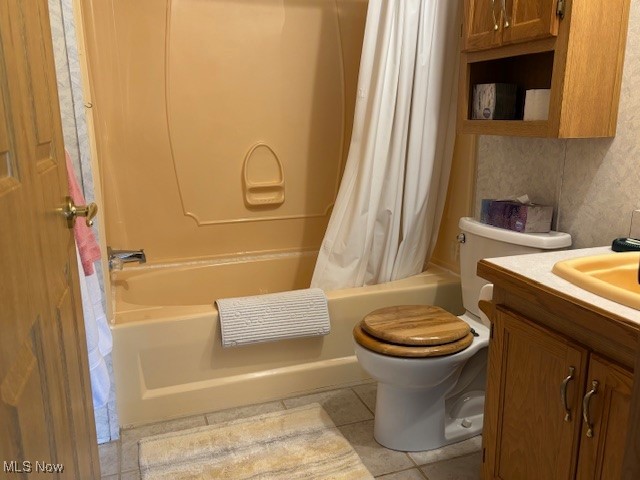 12575 Zane Road Lore City, OH 43755 - Photo 28 of 37 Full bathroom with vanity, shower / bath combo, toilet, and tile patterned floors