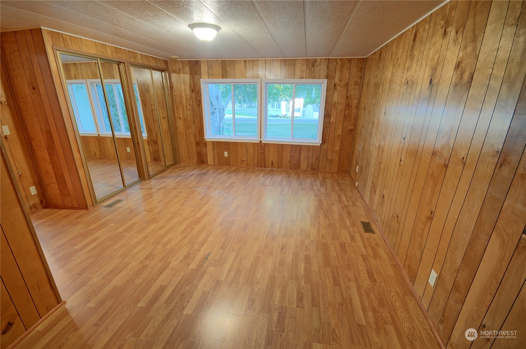 7472 Rd F Southeast, Unit 8 Othello, WA 99344 - Photo 12 of 23 wooden floor in an empty room with a window