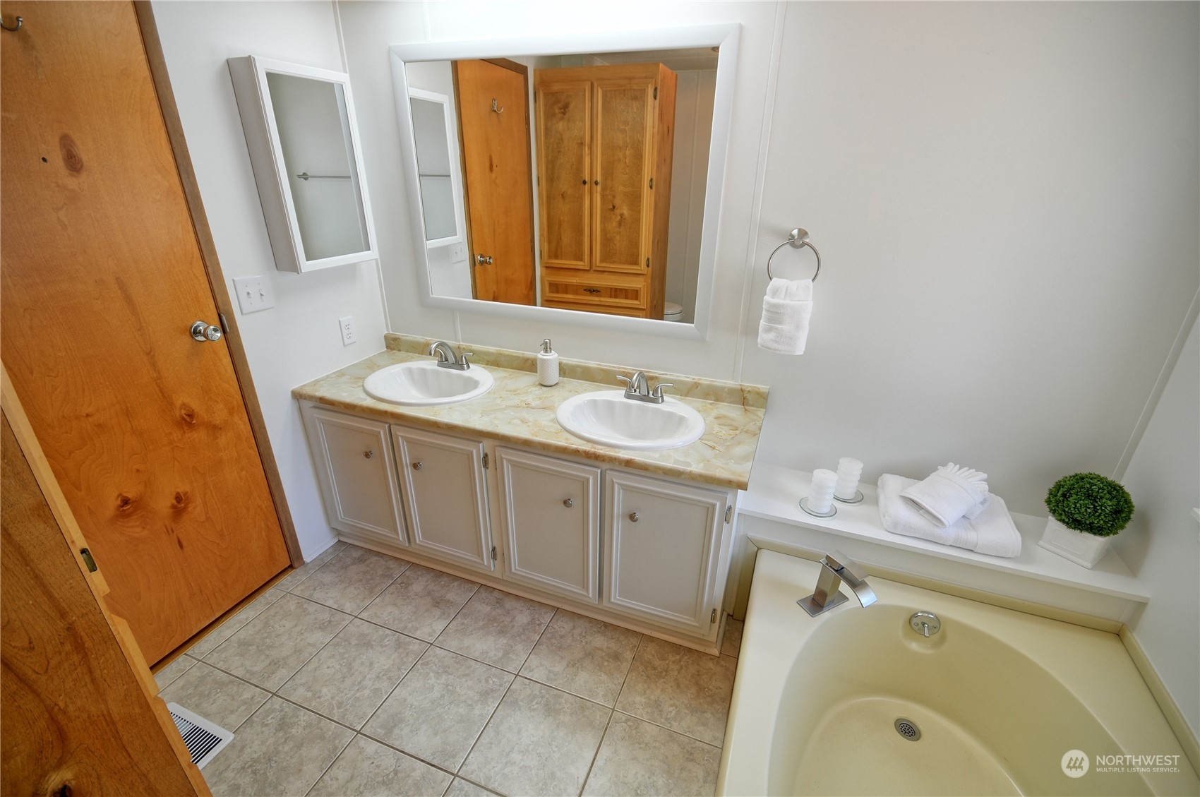 7472 Rd F Southeast, Unit 8 Othello, WA 99344 - Photo 15 of 23 a bathroom with a granite countertop sink and a mirror