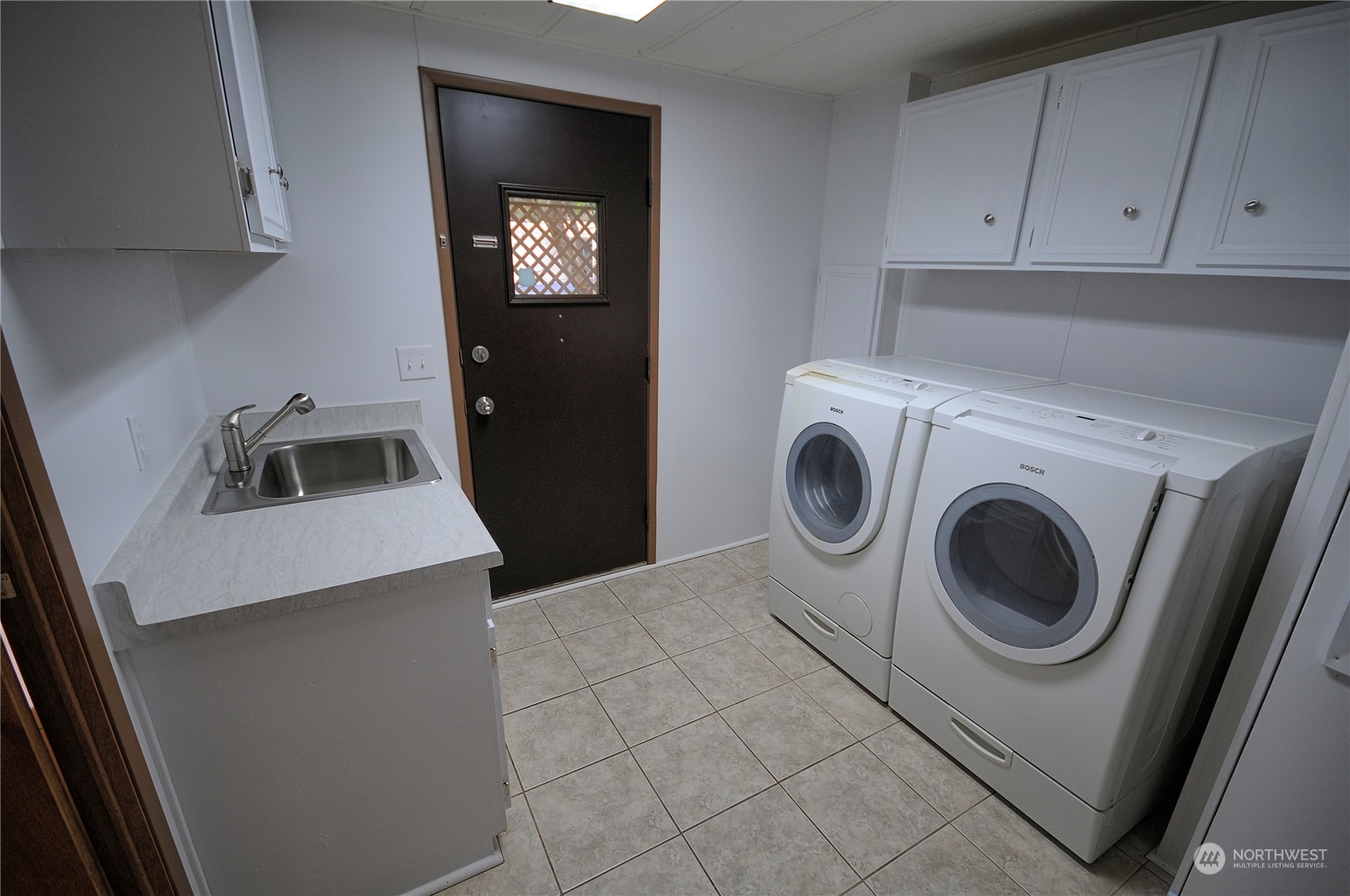 7472 Rd F Southeast, Unit 8 Othello, WA 99344 - Photo 19 of 23 a utility room with sink dryer and washer