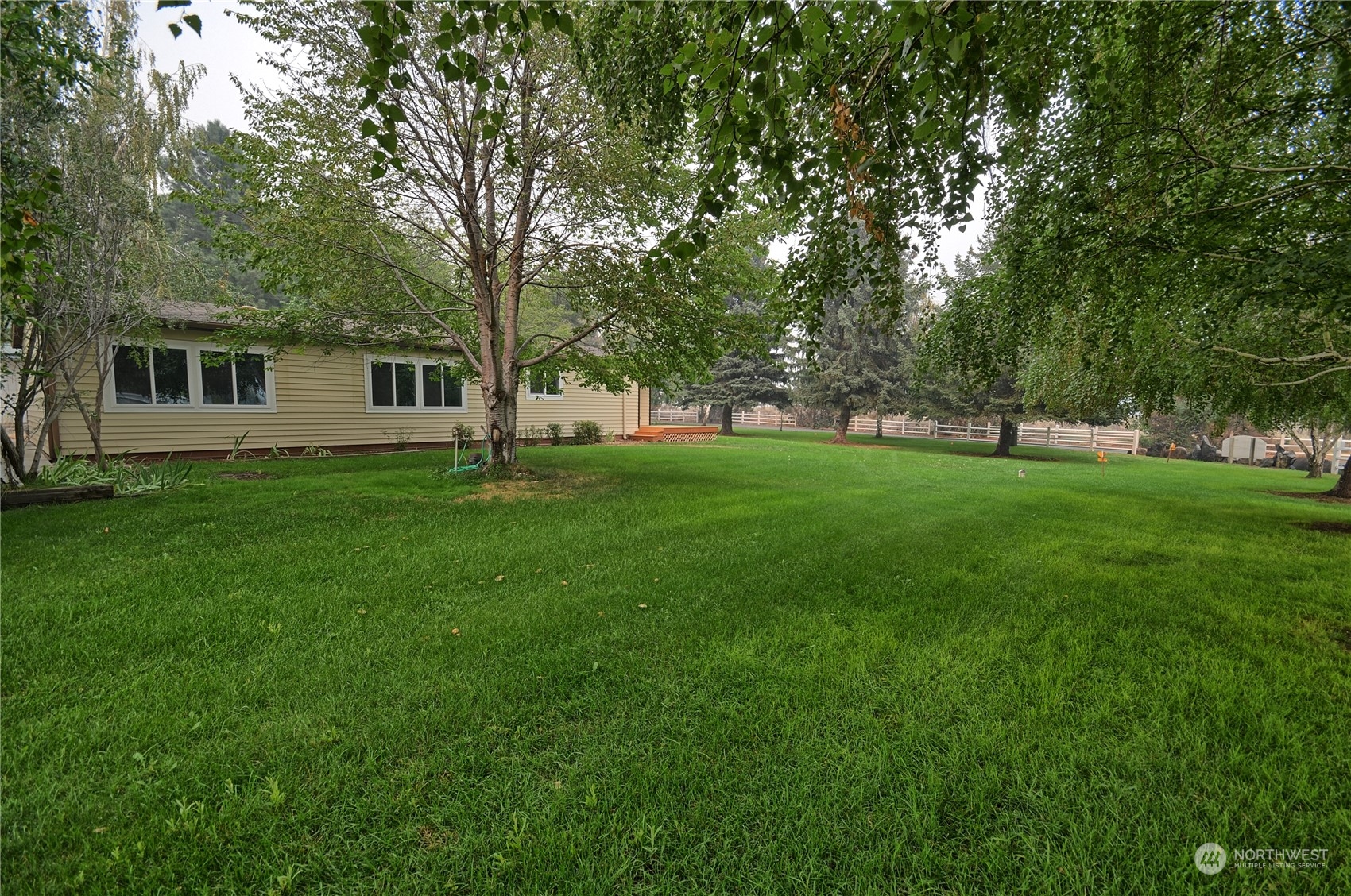 7472 Rd F Southeast, Unit 8 Othello, WA 99344 - Photo 2 of 23 a view of a backyard with a garden