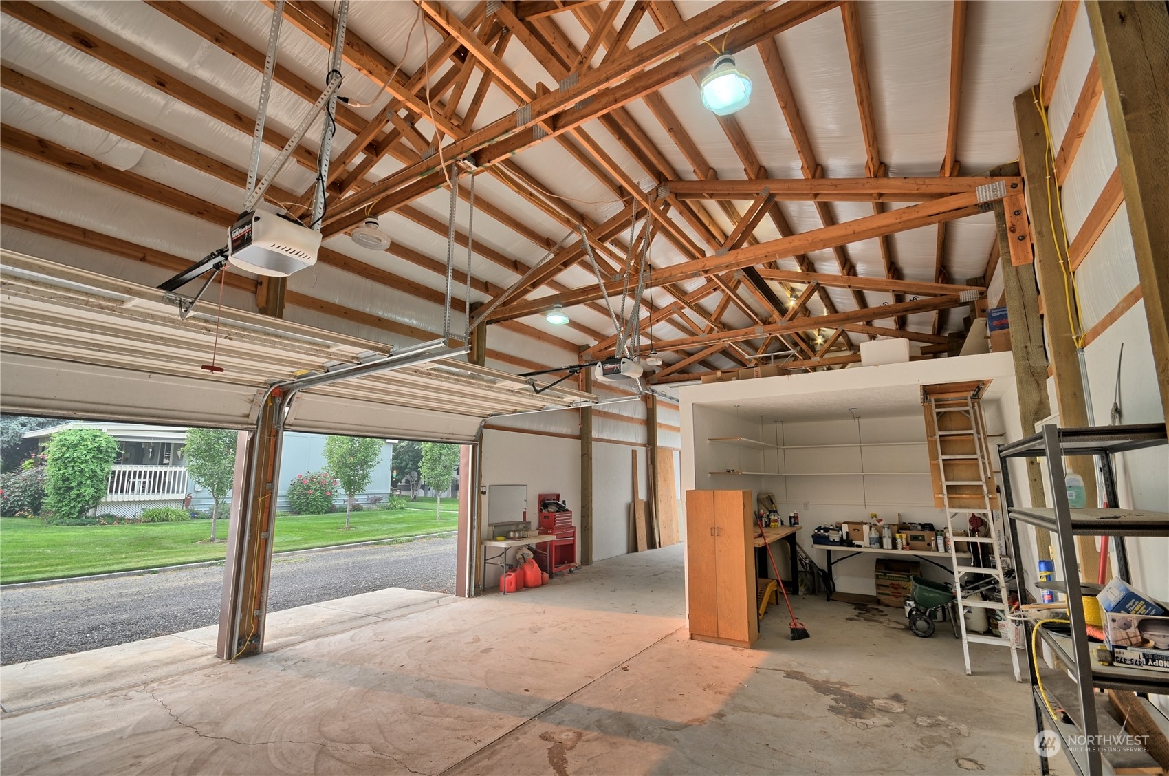 7472 Rd F Southeast, Unit 8 Othello, WA 99344 - Photo 21 of 23 a view of a porch with furniture and a garage