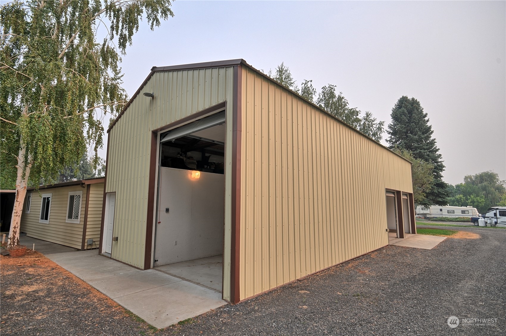 7472 Rd F Southeast, Unit 8 Othello, WA 99344 - Photo 3 of 23 a view of a house with a garage
