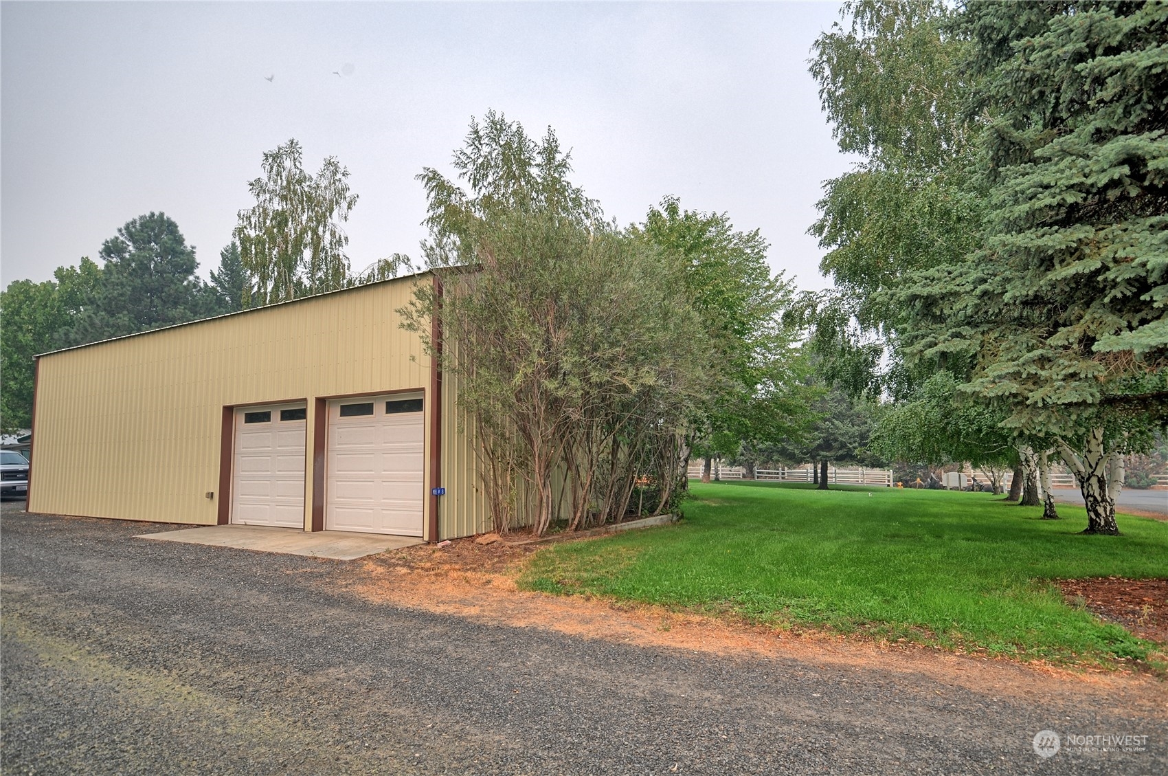 7472 Rd F Southeast, Unit 8 Othello, WA 99344 - Photo 4 of 23 a view of a house with a yard and garage