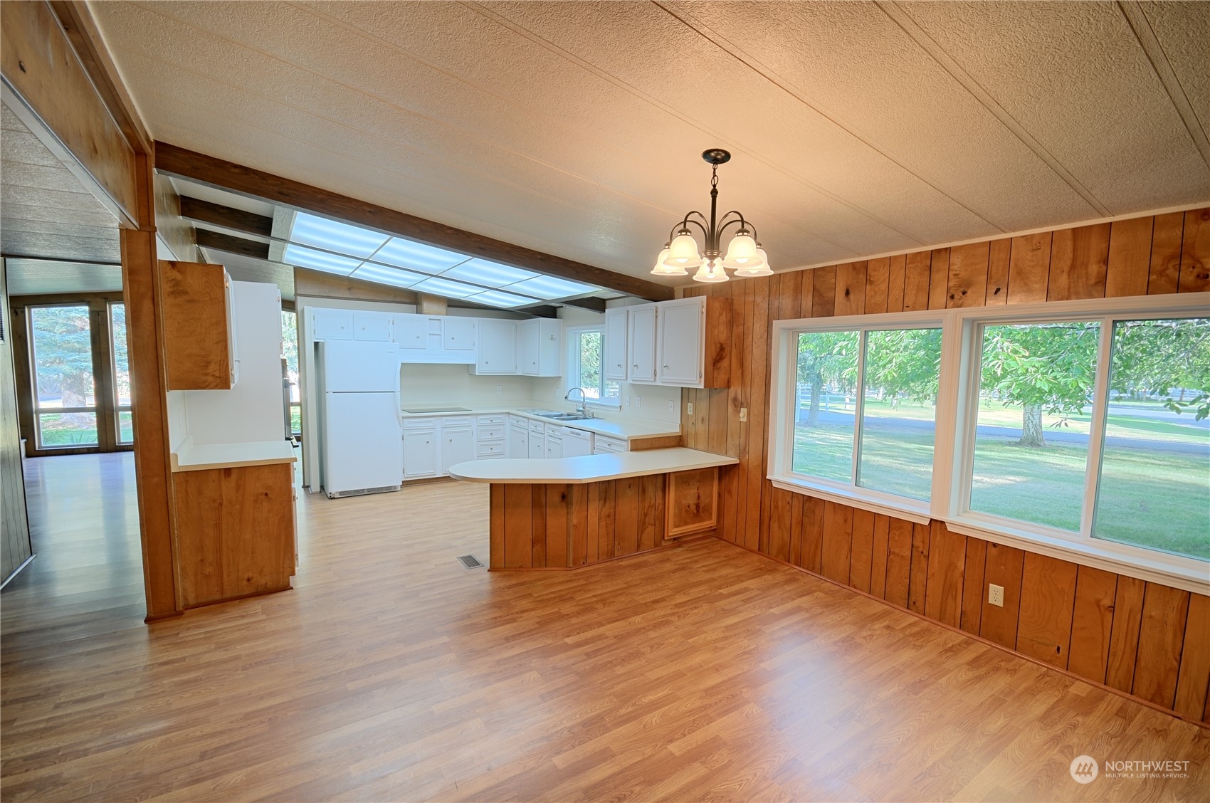 7472 Rd F Southeast, Unit 8 Othello, WA 99344 - Photo 7 of 23 an empty room with wooden floor and windows