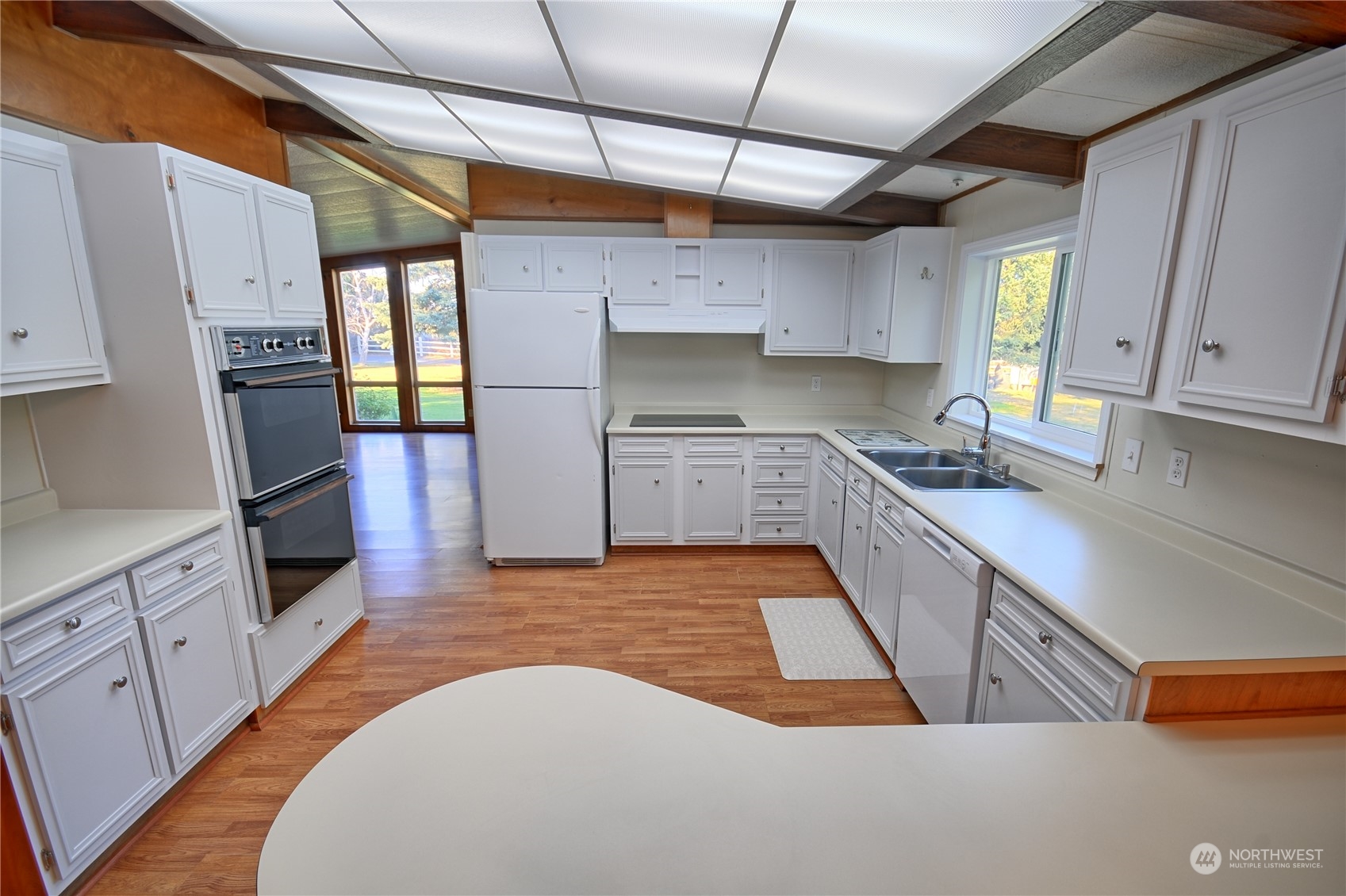 7472 Rd F Southeast, Unit 8 Othello, WA 99344 - Photo 8 of 23 a kitchen with stainless steel appliances granite countertop a sink a stove and cabinets
