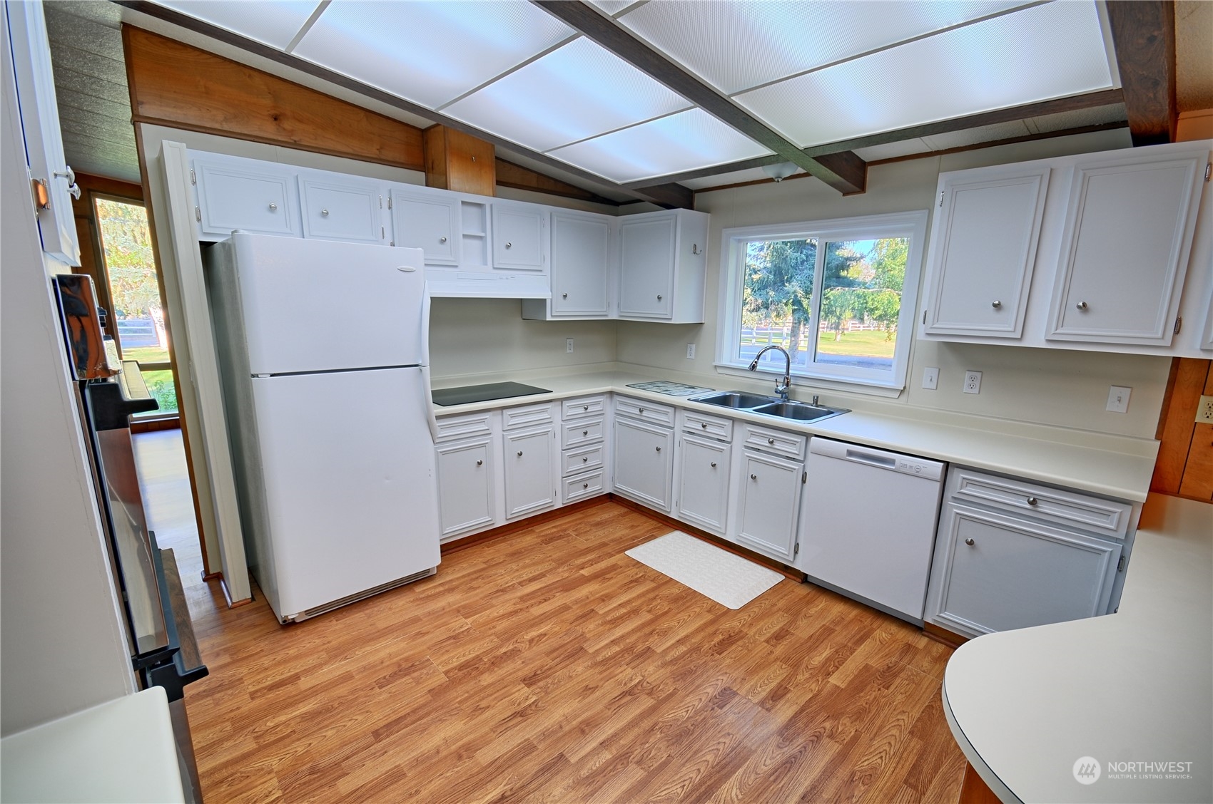 7472 Rd F Southeast, Unit 8 Othello, WA 99344 - Photo 9 of 23 a kitchen with stainless steel appliances granite countertop a refrigerator sink and cabinets
