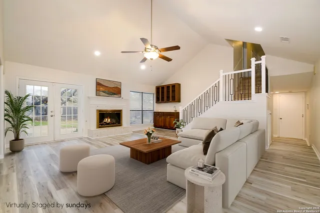 a living room with furniture fireplace and a flat screen tv