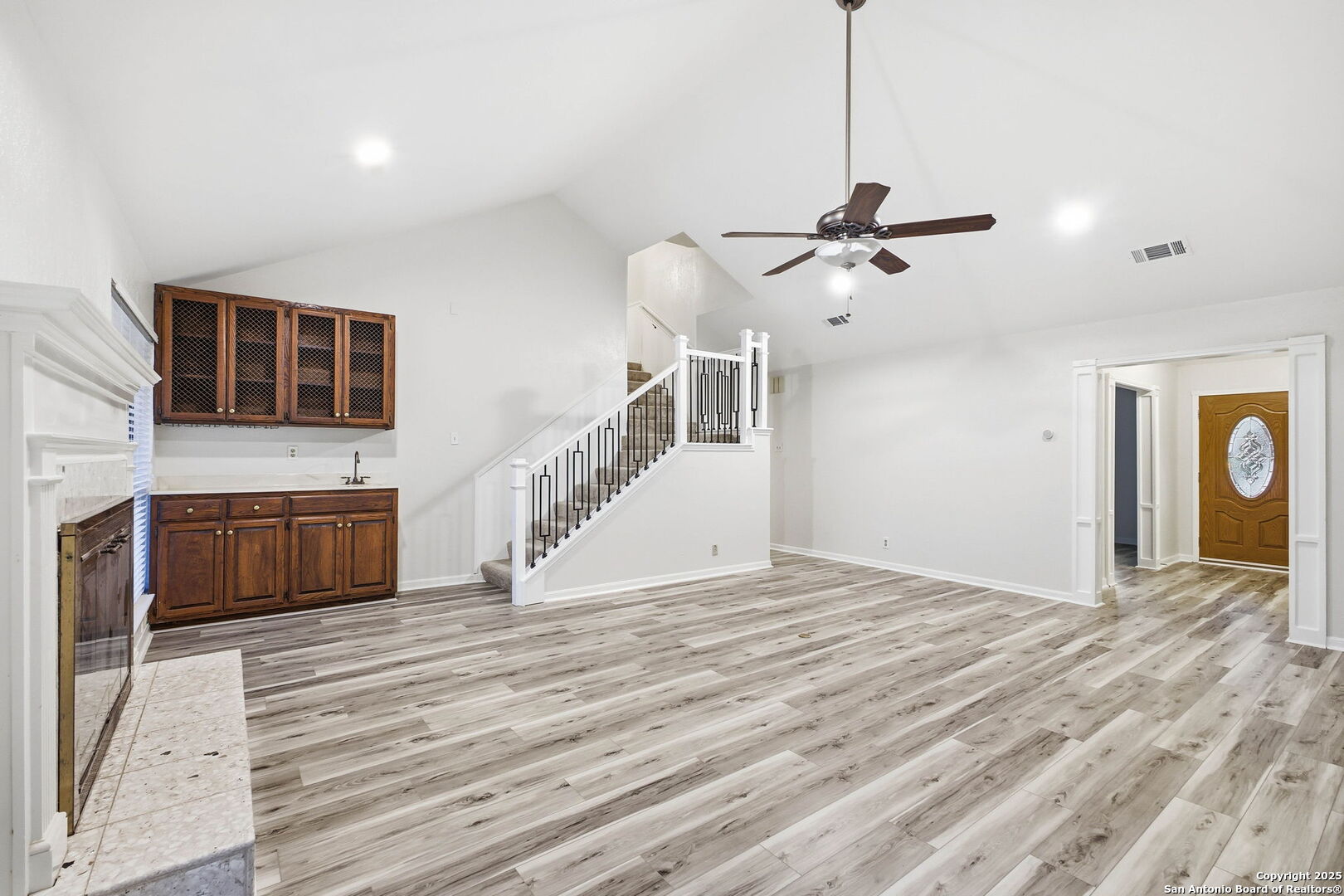 13123 Hunters Spring San Antonio, TX 78230 - Photo 15 of 42 a view of an empty room with a kitchen and a window