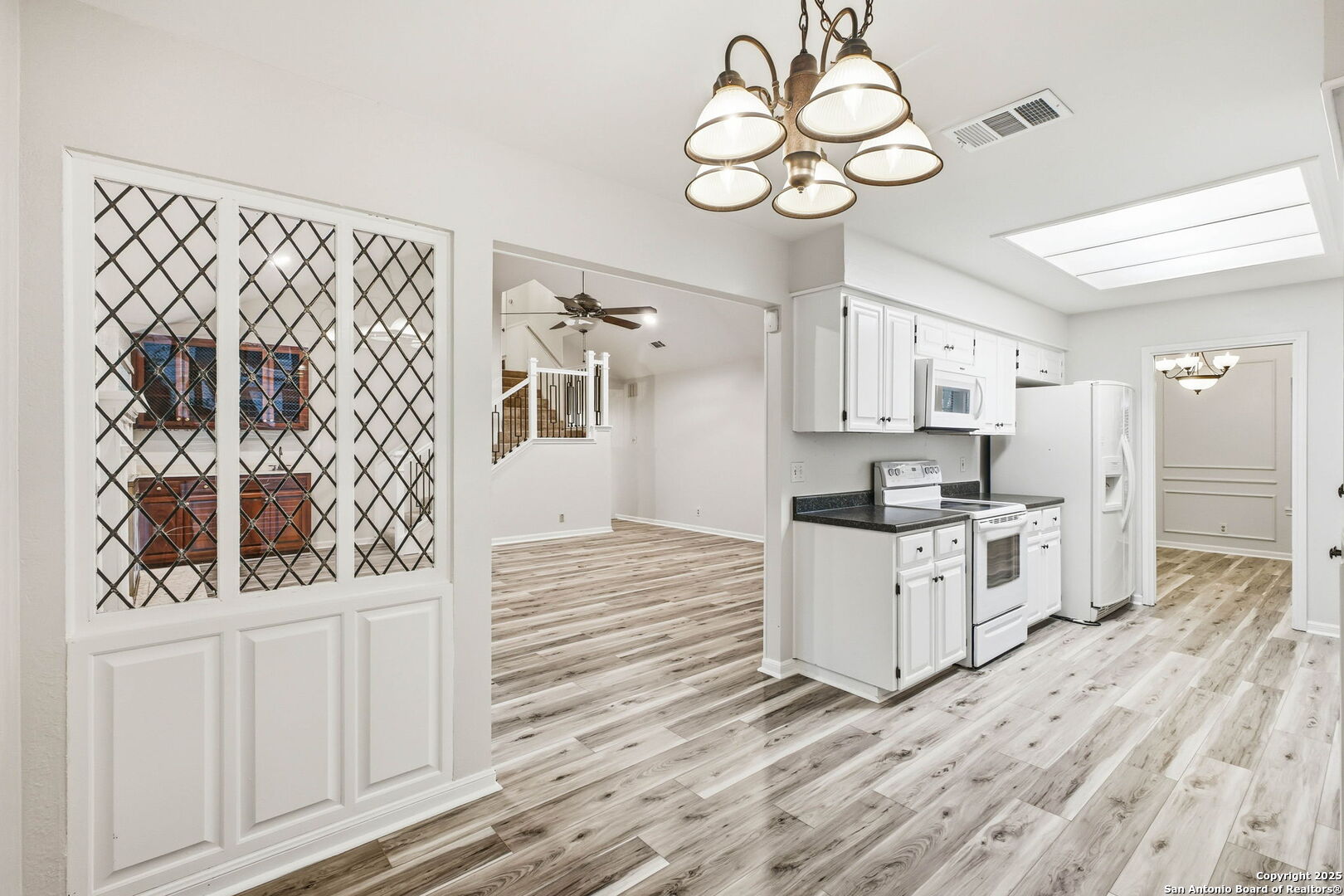 13123 Hunters Spring San Antonio, TX 78230 - Photo 19 of 42 a kitchen with white cabinets and window