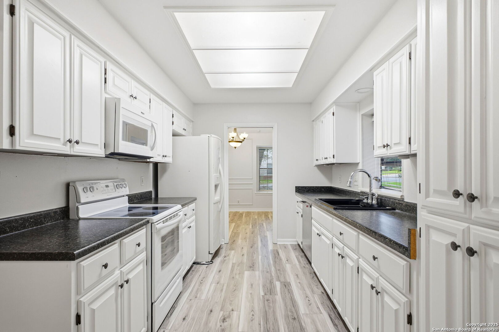 13123 Hunters Spring San Antonio, TX 78230 - Photo 22 of 42 a kitchen with granite countertop a sink stove and cabinets
