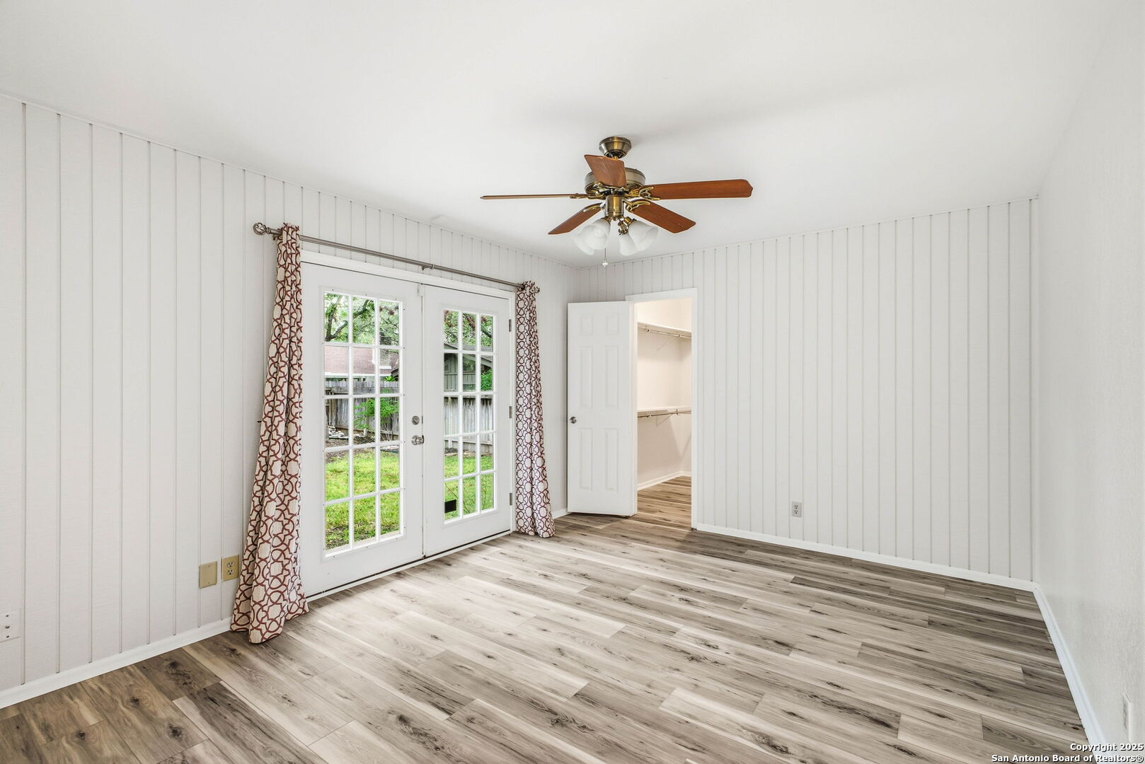 13123 Hunters Spring San Antonio, TX 78230 - Photo 23 of 42 an empty room with wooden floor and windows