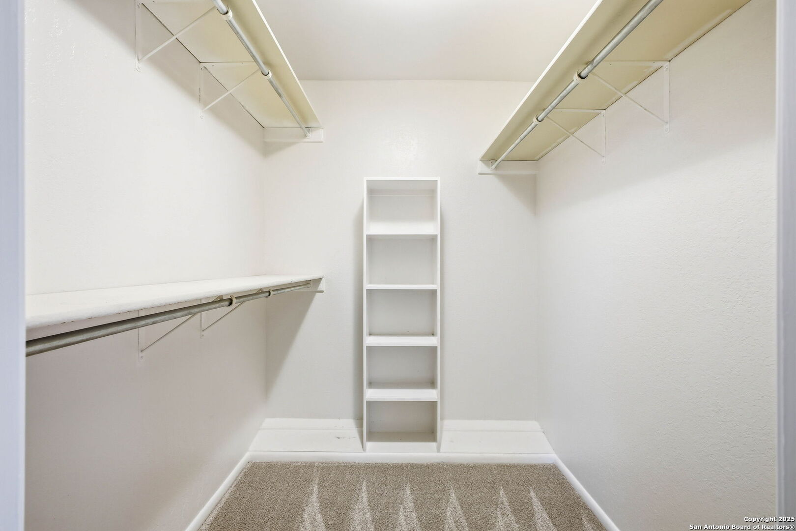 13123 Hunters Spring San Antonio, TX 78230 - Photo 33 of 42 a view of walk in closet with empty racks