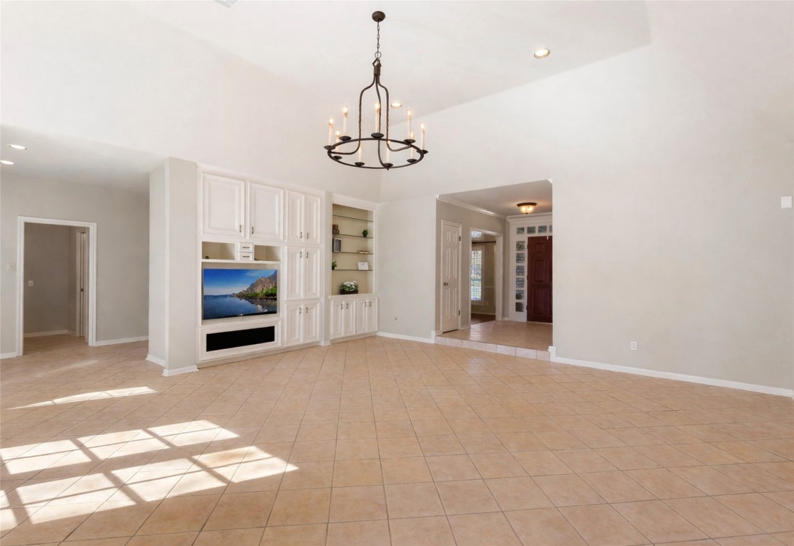 25722 Overlake Drive Spring, TX 77380 - Photo 14 of 50 To the left, the home flows into the breakfast nook and kitchen, with convenient access to the laundry room, half bath, and a secondary rear entry to the backyard and detached garage.