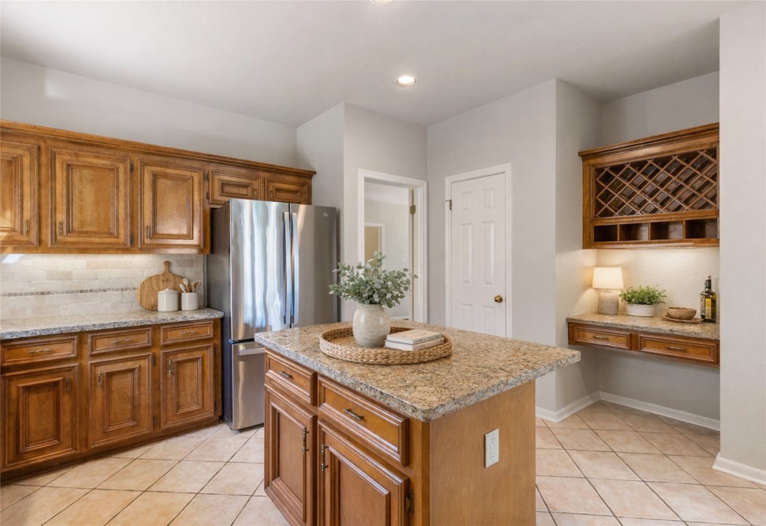 25722 Overlake Drive Spring, TX 77380 - Photo 18 of 50 Access the walk-in pantry through the door on the left. Adjacent is the light-filled dining space with large windows and a chandelier, offering both style and function.