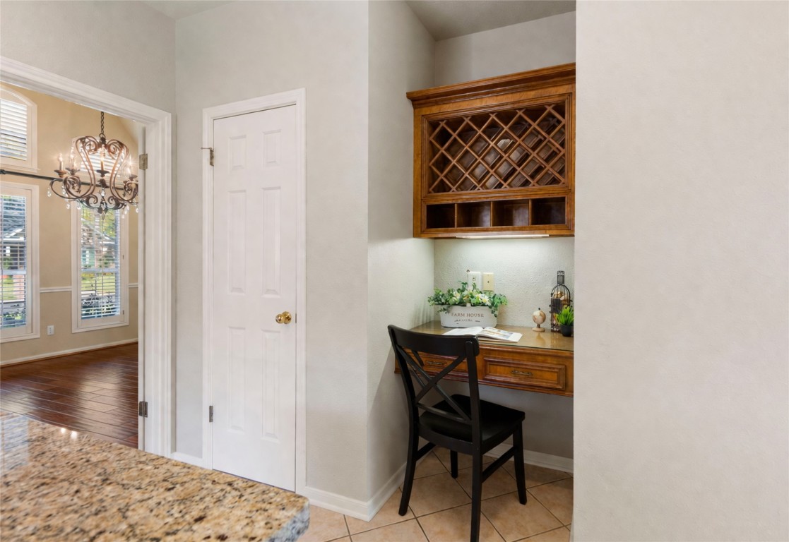 25722 Overlake Drive Spring, TX 77380 - Photo 19 of 50 Enjoy the charming nook with a built-in desk and wine rack, perfect as a study or bar area.