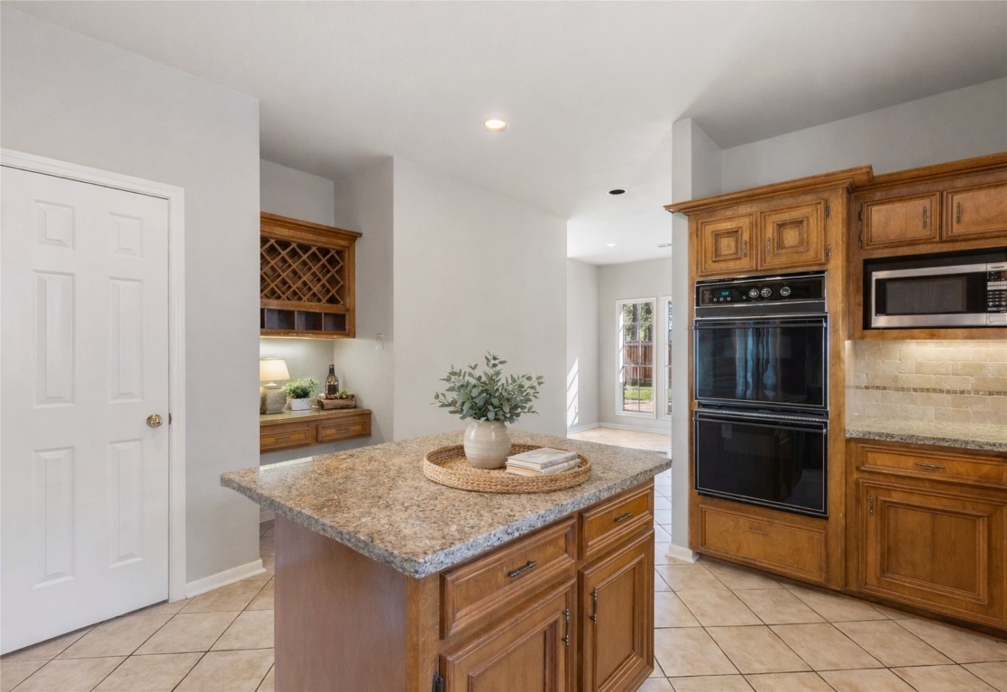25722 Overlake Drive Spring, TX 77380 - Photo 20 of 50 The kitchen features updated granite countertops and the island offers extra prep space - perfect for family and social gatherings!
