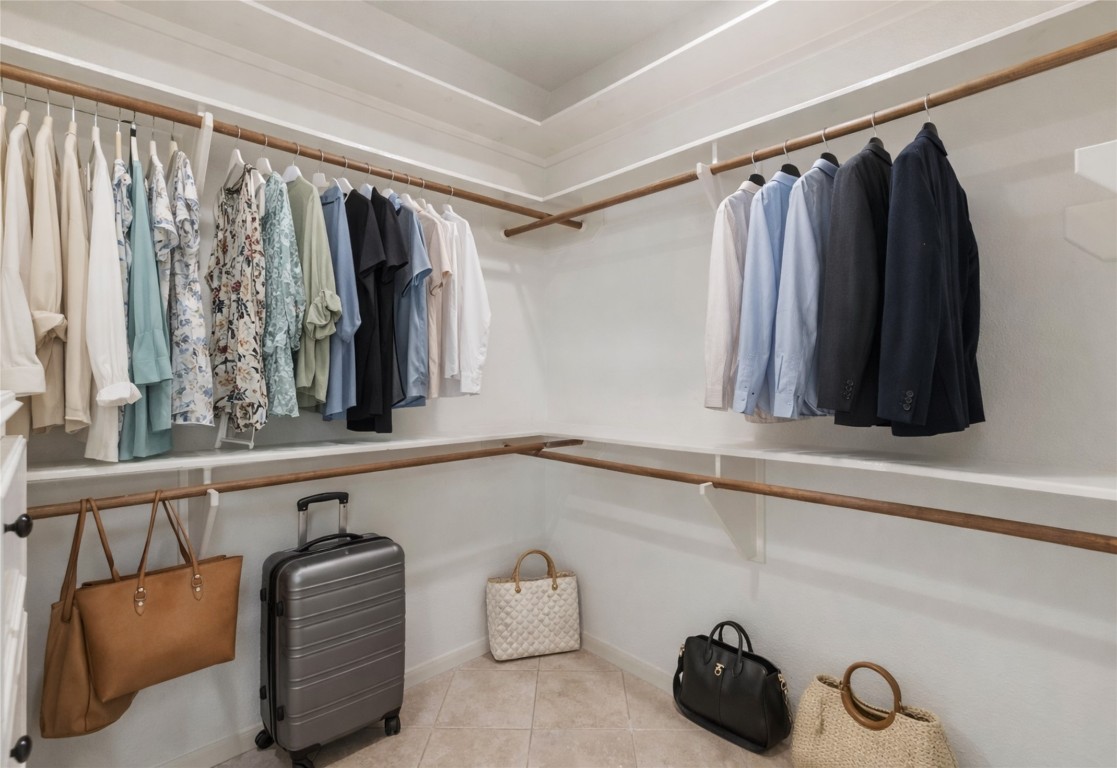 25722 Overlake Drive Spring, TX 77380 - Photo 26 of 50 Photos don’t do this closet justice, it’s incredibly spacious, with built-in shelving, drawers, and more than enough room for two!