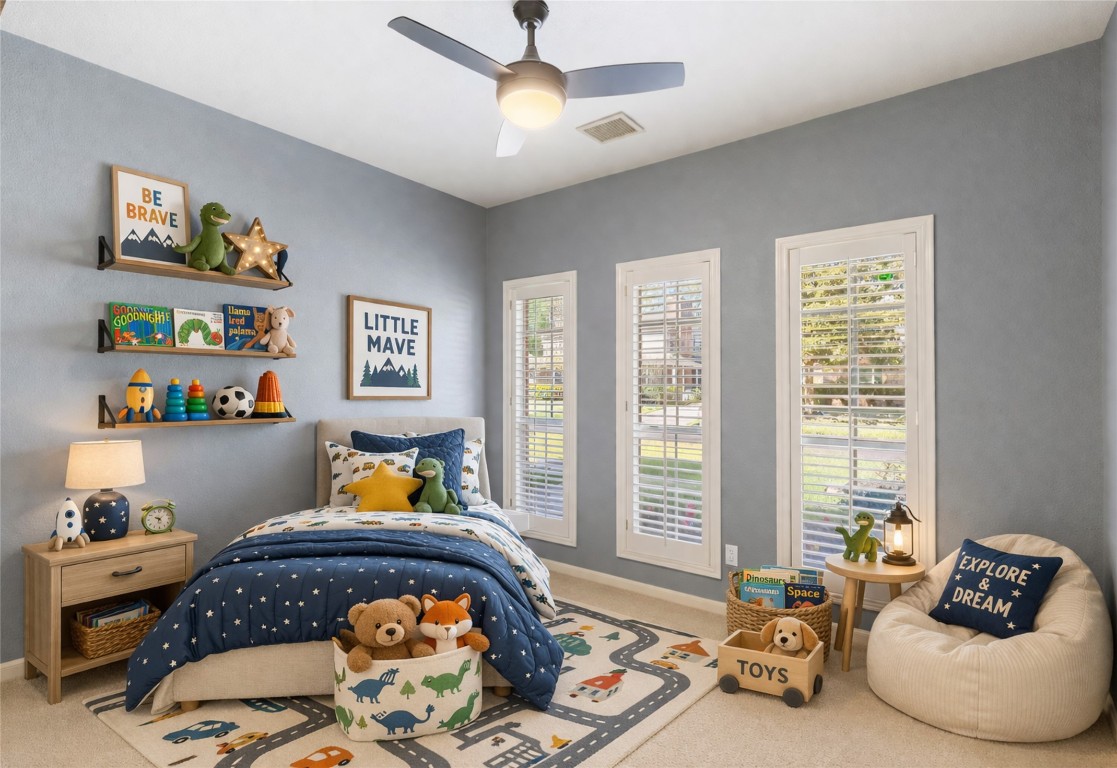 25722 Overlake Drive Spring, TX 77380 - Photo 33 of 50 The front left secondary bedroom features built-in shelving, plantation shutters, a ceiling fan, and a generously sized closet. A separate storage closet with built-in shelving is conveniently located between the two front secondary bedrooms.