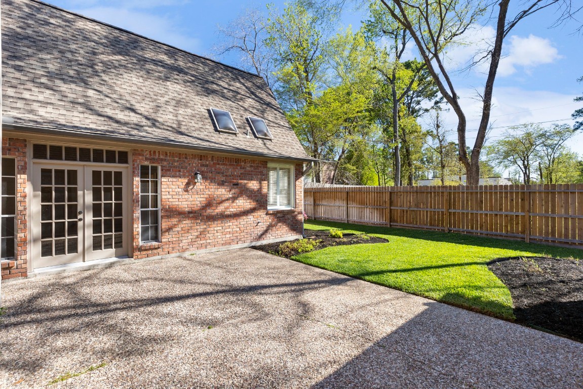 25722 Overlake Drive Spring, TX 77380 - Photo 39 of 50 Beyond the courtyard-style patio, green space extends to both the left and right. Enjoy the added benefit of a recently replaced back fence!