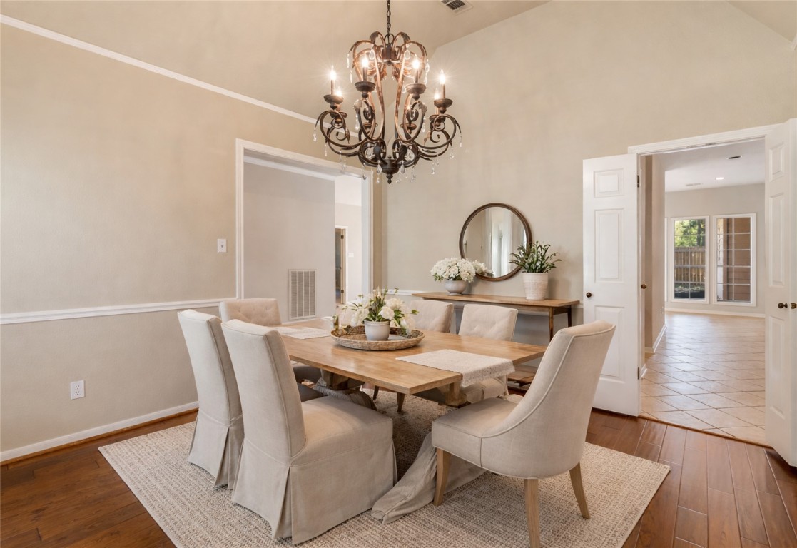 25722 Overlake Drive Spring, TX 77380 - Photo 9 of 50 Beautifully appointed with rich hardwood floors, refined crown molding, and chair rail accents.