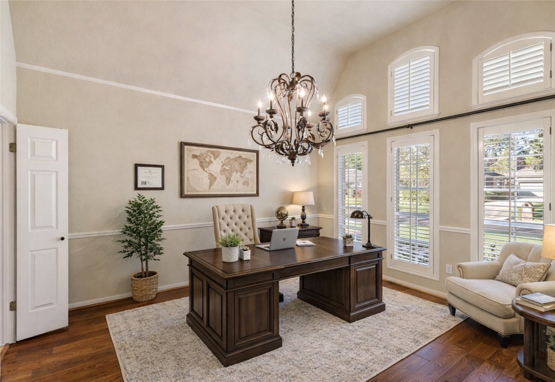 25722 Overlake Drive Spring, TX 77380 - Photo 10 of 50 Virtually staged as a study/home office to highlight the versatility of the formal dining room. Note the designer chandelier and sought-after plantation shutters, ideal additions for either a workspace or dining setting.