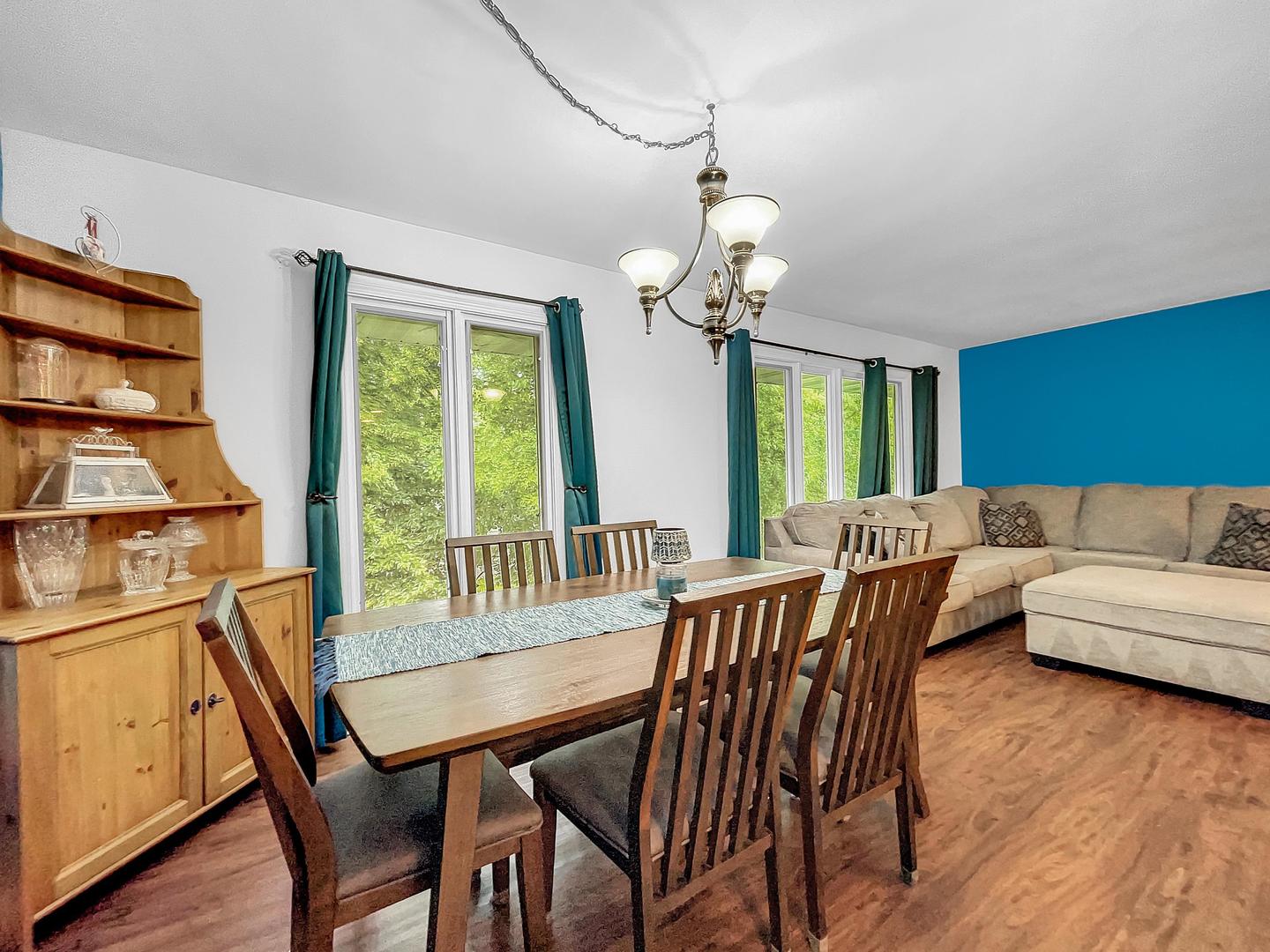 25 Aldon Road Montgomery, IL 60538 - Photo 11 of 38 a view of a dining room with furniture window and wooden floor