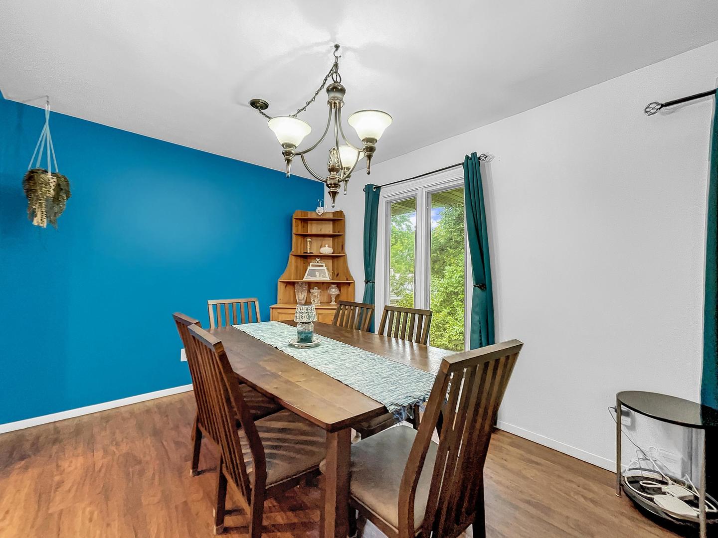 25 Aldon Road Montgomery, IL 60538 - Photo 12 of 38 a view of a dining room with furniture wooden floor and chandelier