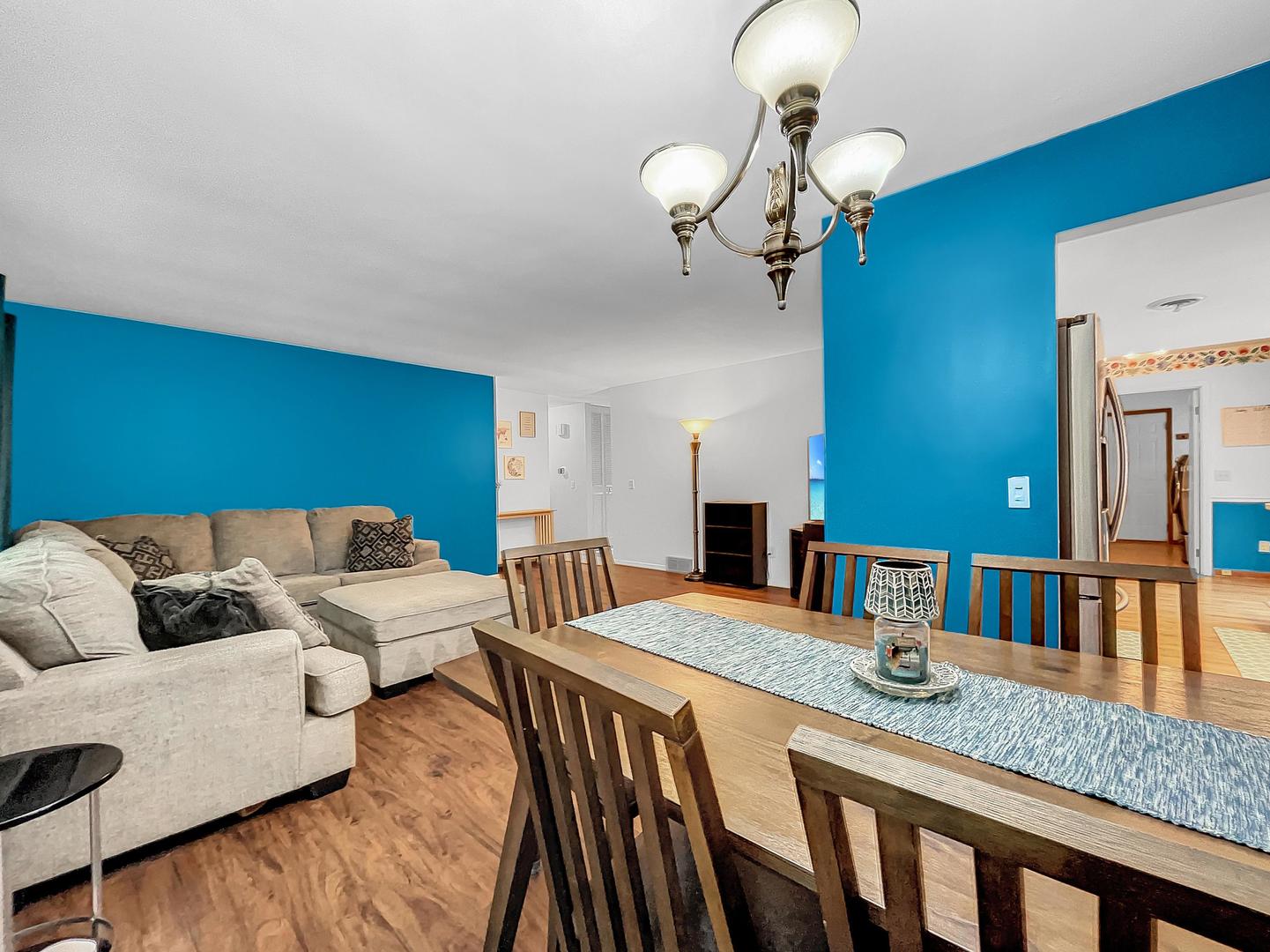 25 Aldon Road Montgomery, IL 60538 - Photo 13 of 38 a living room with couches a dining table chairs and couches
