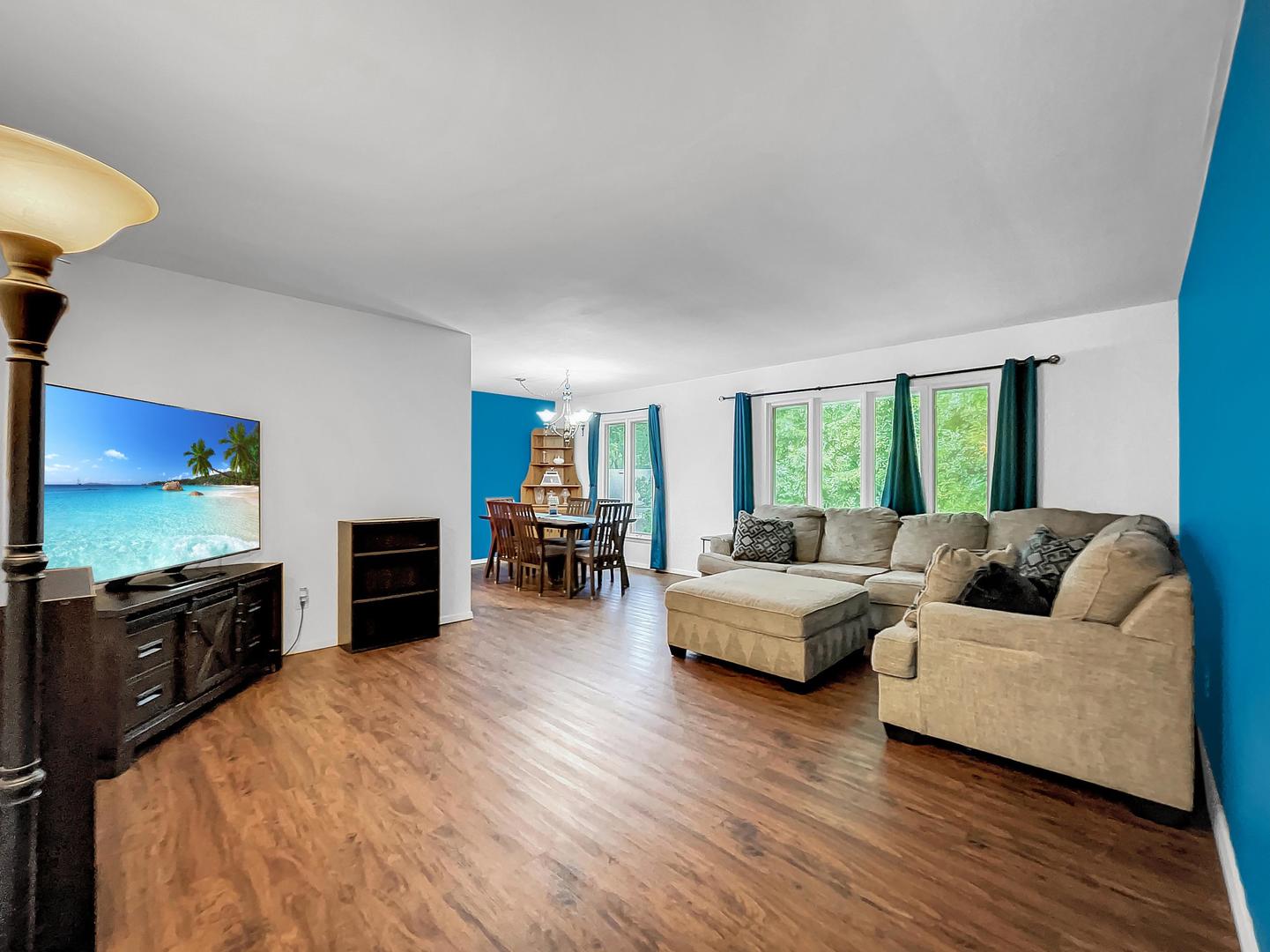 25 Aldon Road Montgomery, IL 60538 - Photo 15 of 38 a living room with furniture flat screen tv and a fireplace