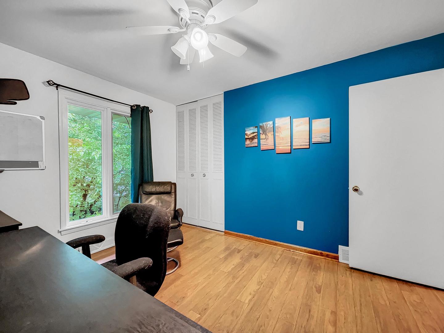 25 Aldon Road Montgomery, IL 60538 - Photo 17 of 38 a workspace with wooden floor and windows