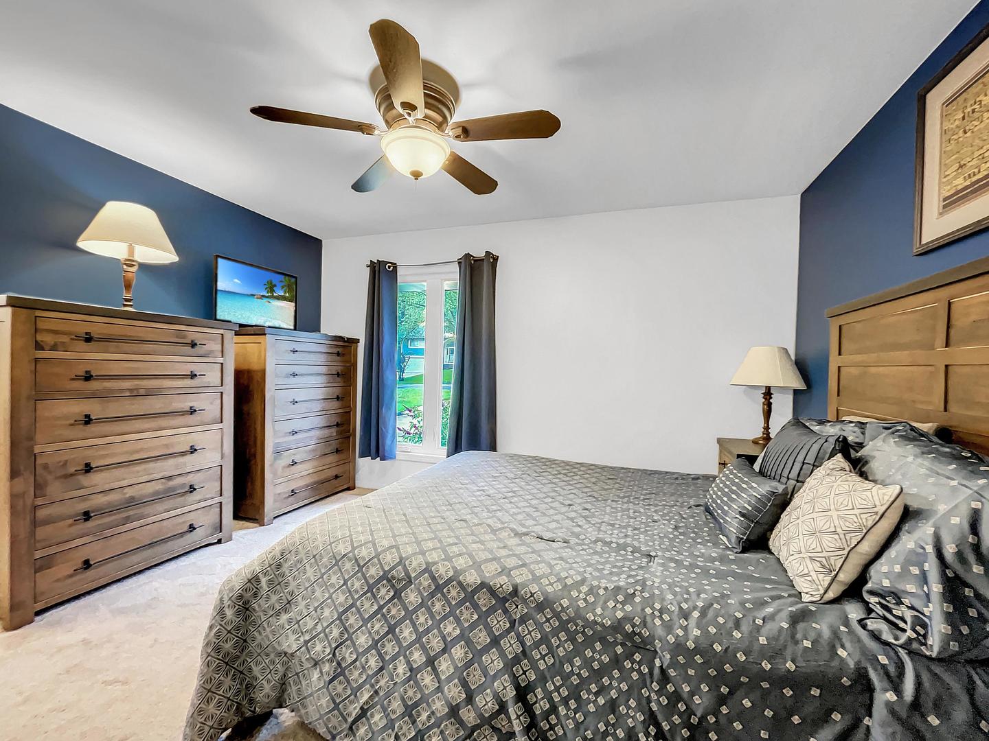 25 Aldon Road Montgomery, IL 60538 - Photo 24 of 38 a bedroom with a bed and a chandelier