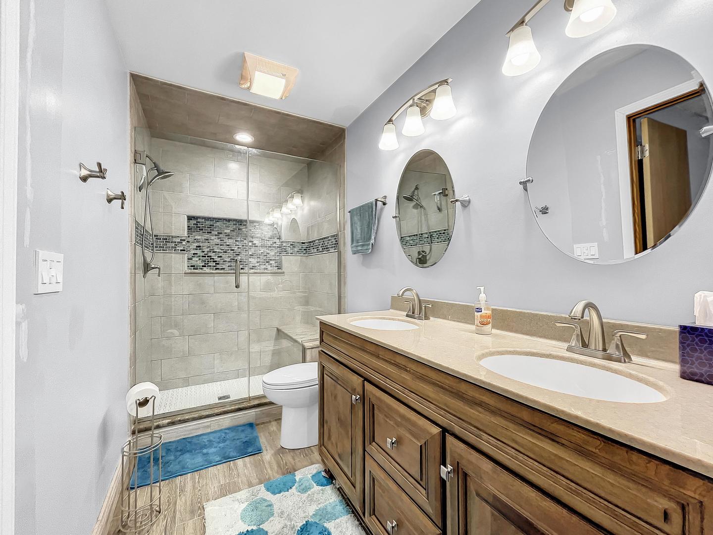 25 Aldon Road Montgomery, IL 60538 - Photo 26 of 38 a bathroom with a double vanity sink mirror and shower