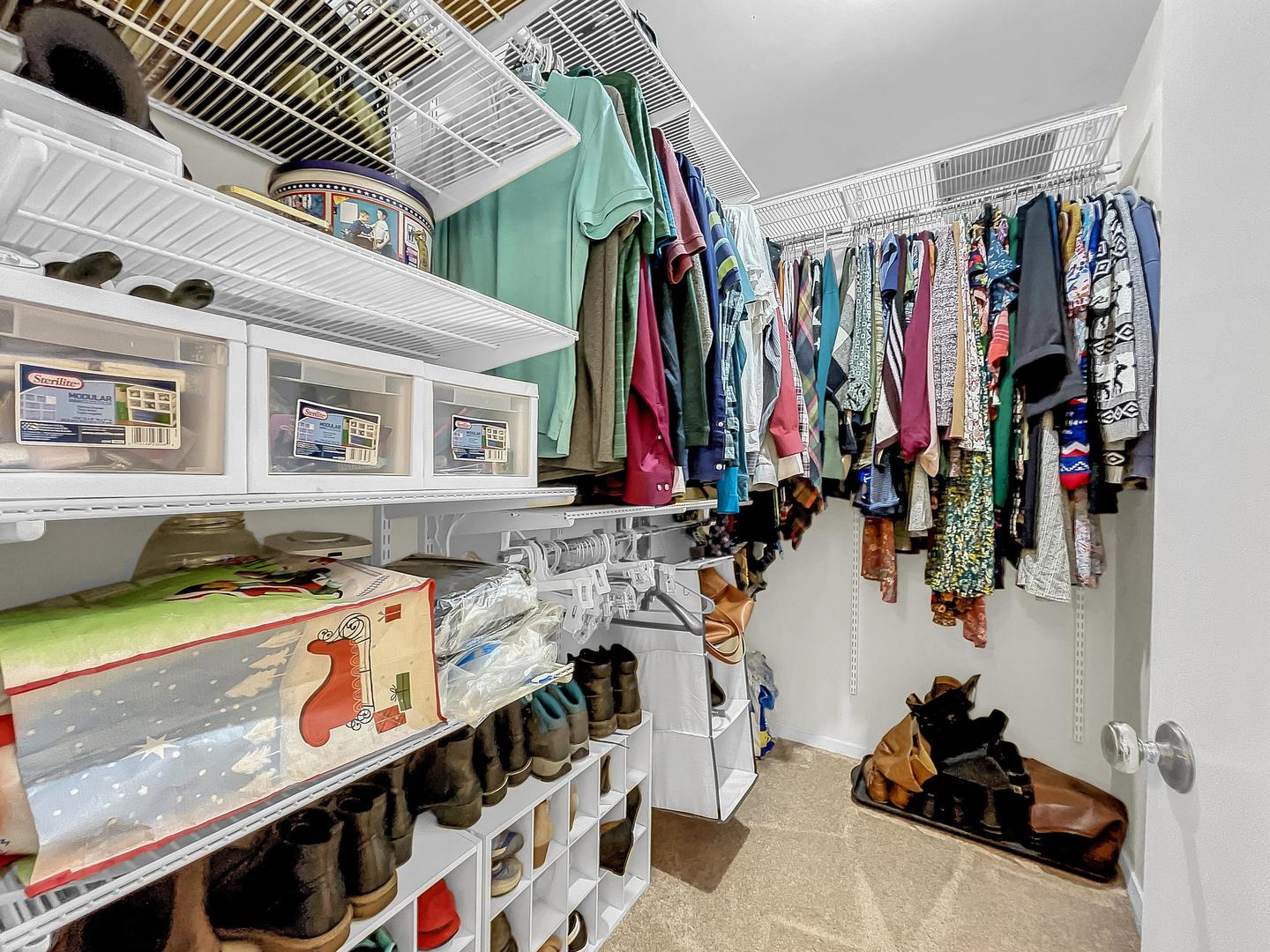 25 Aldon Road Montgomery, IL 60538 - Photo 38 of 38 a view of walk in closet with clothes and shoes