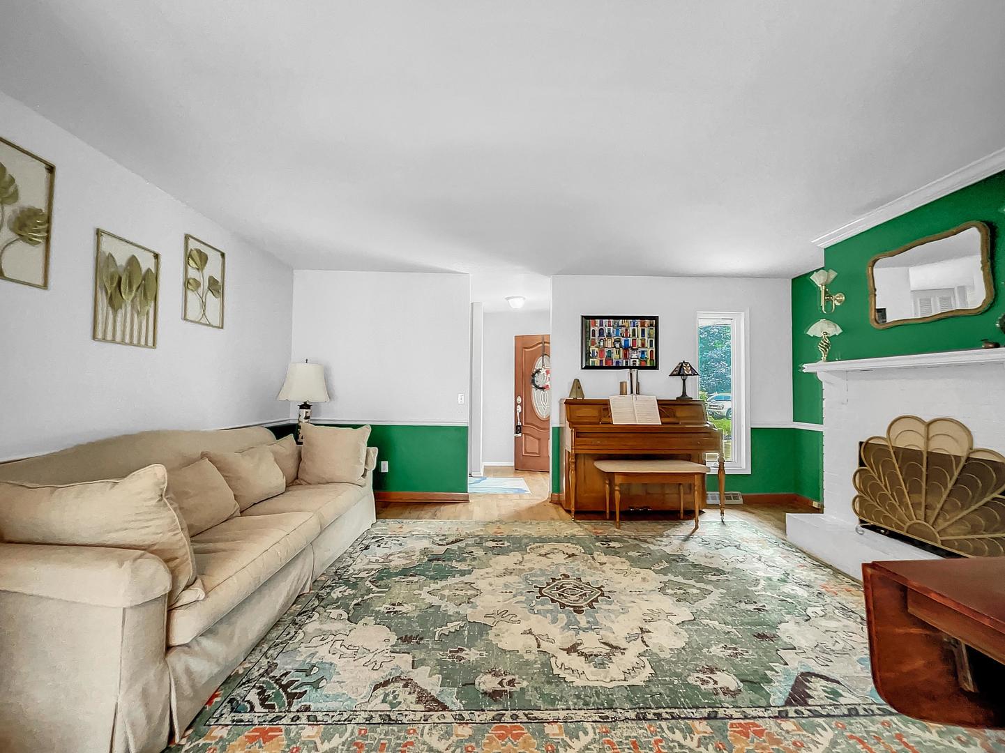 25 Aldon Road Montgomery, IL 60538 - Photo 5 of 38 a living room with furniture and a fireplace