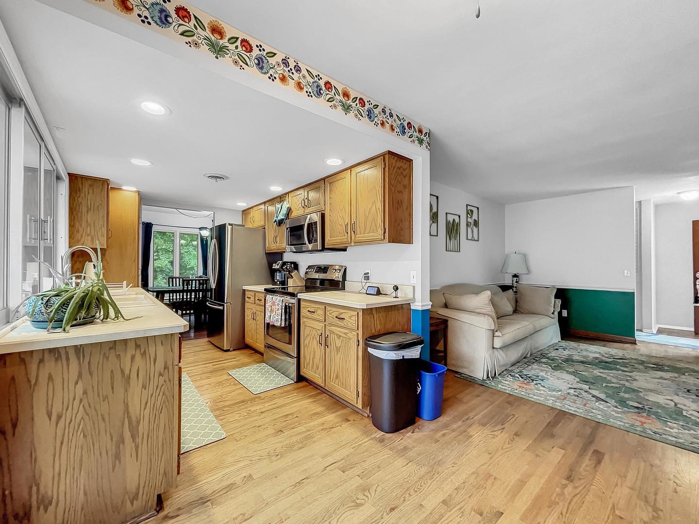 25 Aldon Road Montgomery, IL 60538 - Photo 8 of 38 a view of a kitchen with kitchen island a counter top space a sink stainless steel appliances and cabinets