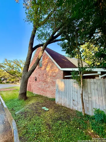 a view of backyard with swimming pool