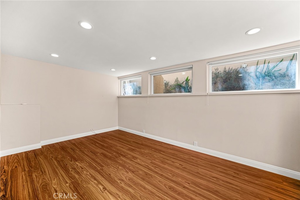3751 Prestwick Drive Los Angeles, CA 90027 - Photo 21 of 50 a view of empty room with wooden floor and fan