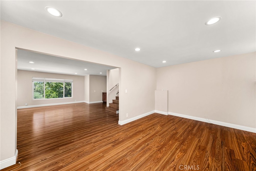 3751 Prestwick Drive Los Angeles, CA 90027 - Photo 22 of 50 an empty room with wooden floor and windows