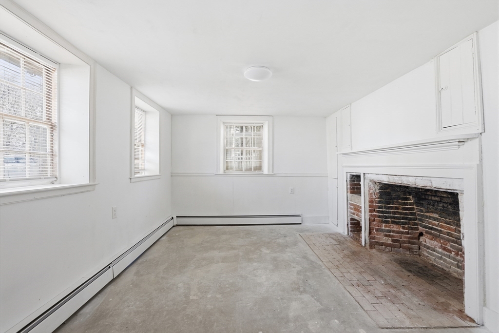 4 Townsend Street Pepperell, MA 01463 - Photo 13 of 27 a view of empty room with fireplace